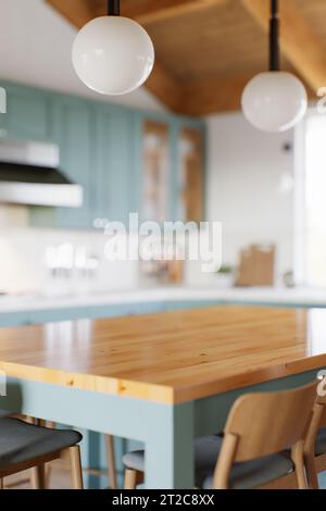 Piano cucina vuoto con sfondo sfocato con elettrodomestici e utensili. Foto Stock