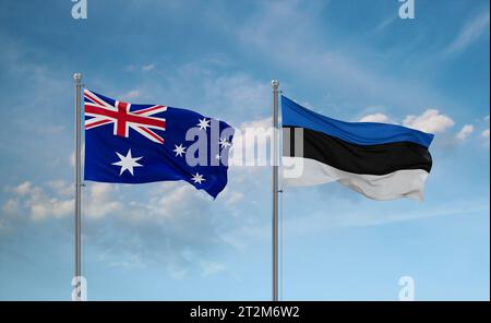 Le bandiere dell'Estonia e dell'Australia sventolano insieme su un cielo nuvoloso blu, concetto di relazione tra due paesi Foto Stock