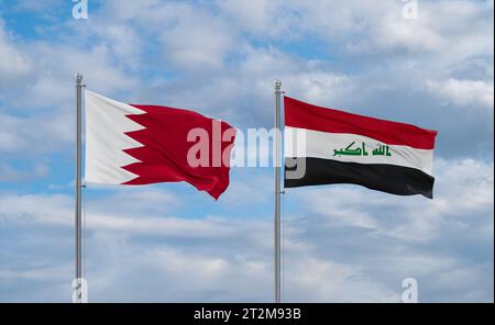 Iraq e Bahrein bandiere che sventolano insieme su un cielo nuvoloso blu Foto Stock