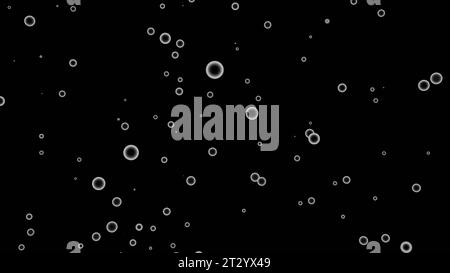 Bolle d'aria volanti in modo casuale su sfondo nero. Progettazione. Silhouette ad anello in risalto. Foto Stock