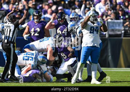 Baltimore, United States. 22nd Oct, 2023. Detroit Lions defensive end Aidan Hutchinson (C) recovers a Baltimore Ravens fumble during the first half at M&T Bank Stadium in Baltimore, Maryland, on Sunday, October 22, 2023. Photo by David Tulis/UPI Credit: UPI/Alamy Live News Stock Photo