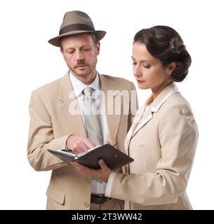 Vintage manager e segretario lavorando insieme controllare le note e gli appuntamenti Foto Stock
