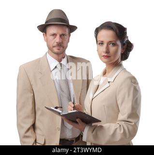 Vintage manager e segretario lavorando insieme controllare le note e gli appuntamenti Foto Stock