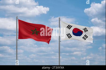 Corea del Sud o Repubblica di Corea o ROK e Marocco bandiere che sventolano insieme nel vento su un cielo blu nuvoloso, concetto di relazione tra due paesi Foto Stock