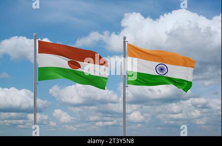 Le bandiere dell'India e del Niger sventolano insieme su un cielo nuvoloso blu, concetto di due relazioni tra paesi Foto Stock