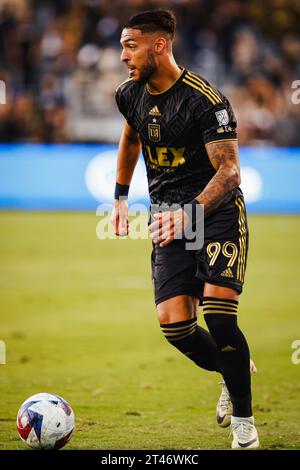 28 ottobre 2023; Los Angeles, CA, Stati Uniti; l'attaccante del Los Angeles FC Denis Bouanga (99) avanza la palla contro i Vancouver Whitecaps in gara 1 in una partita del primo turno dei playoff della MLS Cup 2023 al BMO Stadium (Ariel Fox/Image of Sport) Foto Stock