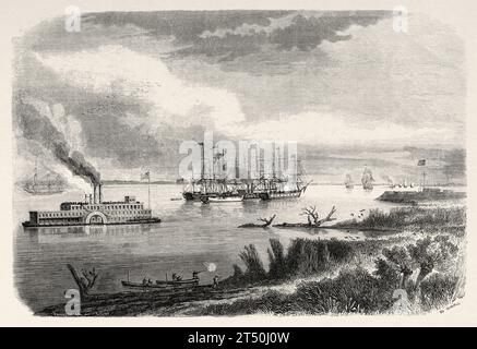 Vecchia vista del battello a vapore e del rimorchiatore che navigano lungo il Mississippi, Stati Uniti. Frammento di un viaggio a New Orleans nel 1855 di Elisee Reclus (1830 - 1905). Incisione del vecchio XIX secolo da le Tour du Monde 1860 Foto Stock