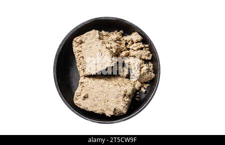 Halva con semi di girasole e miele in padella. Isolato su sfondo bianco Foto Stock