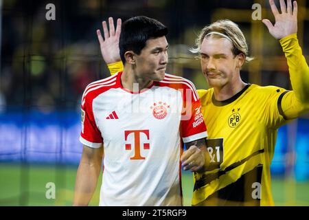 Dortmund, Signal-Iduna-Park, 04.11.23: Minjae Kim (München) (L) und Julian Brandt (Dortmund) beim 1. Bundesliga Spiel Borussia Dortmund contro FC Bayern Foto Stock