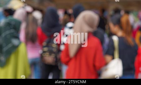 Sfondo sfocato dell'aspetto della persona visto da dietro Foto Stock