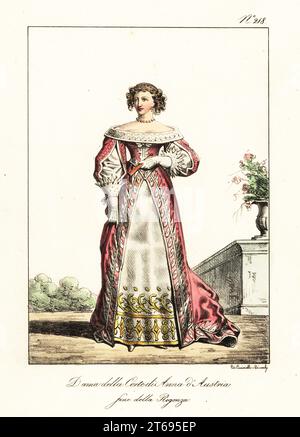 Signora alla corte della regina Anna d'Austria, fine della reggenza francese, intorno al 1650. In abito con maniche a taglio, colletto in pizzo aperto sulle spalle, sottogonna ricamata. Dame de la Cour d'Anne d'Autriche, fin de la Regence. Litografia colorata a mano di Lorenzo Bianchi e Domenico Cuciniello dopo Hippolyte Lecomte da Costumi civili e militari della monarchia francese dal 1200 al 1820, Napoli, 1825. Edizione italiana dei Lecomti costumi civili e militari della monarchia francese dal 1200 al 1820. Foto Stock