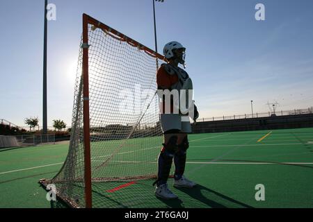 Lacrosse goalie durante il gioco di campionato Foto Stock