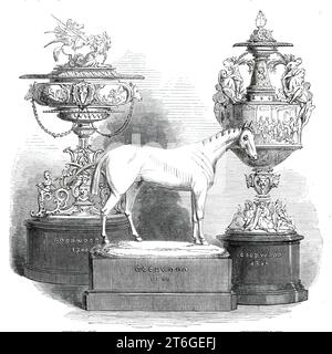 Il Goodwood Race Plate, 1860. "The Stewards" Cup, di Messrs. London e Ryder, è di design e lavorazione accattivanti. La forma generale del vaso assomiglia alle proporzioni di alcuni modelli antichi e le decorazioni scultoree sono opportunamente scelte dalla favola mitologica classica. Il gruppo sulla copertina rappresenta Bellerofonte, montato su Pegaso, il cavallo alato delle Muse, che conquista la Chimera... l'asta è decorata con la testa di Medusa, mostri alati e ragazzi T. W. Reeve è stato il designer e modellatore di questa tazza. La Goodwood Cup, di R. e S. Garrard and Co., è un fi Foto Stock