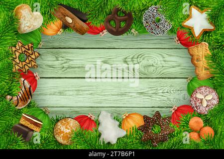 Kekse und Süssigkeiten für Weihnachten mit Tannenzweigen und Weihnachtskugeln Rahmen auf Holz Foto Stock