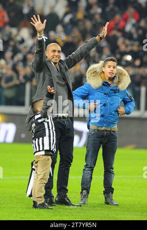 David Trezeguet ex giocatore della Juventus e i suoi figli tifo i suoi tifosi prima del campionato italiano di serie A 2013/2014 tra FC Juventus e AS Roma allo Juventus Stadium il 5 gennaio 2014 a Torino. Foto massimo Cebrelli/DPPI Foto Stock