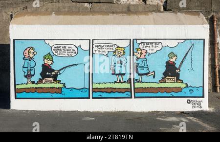 Un murale dell'artista Lewis Hobson di Durham Spray dipinge un cartone animato di Andy Capp, Hartlepool Headland, Inghilterra, Regno Unito Foto Stock