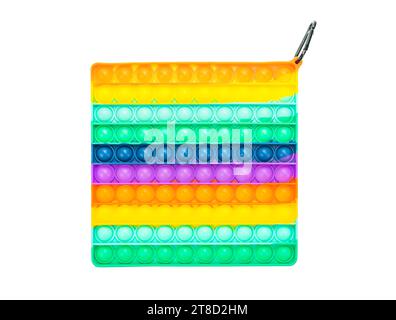 Pastello Color Sensory pop it giocattolo antistress per bambini. giocattolo in silicone arcobaleno su sfondo bianco. Foto Stock