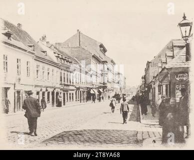 12th, Schönbrunner Straße - Vista dall'alto Korbergasse contro Gaudenzdorfer Gürtel, cartolina, Sperlings Postkartenverlag (M. S.), Producer, 1900-1905, cartone, colloype, altezza x larghezza 9 x 14 cm, dodicesimo distretto: Meidling, strada, la solita casa o fila di case, appartamento, casa in appartamento, casa combinata con negozio, con persone, la collezione Vienna Foto Stock