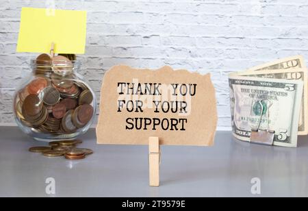 Grazie per il tuo cartello di supporto - testo in gesso bianco su una lavagna in ardesia vintage. Foto Stock