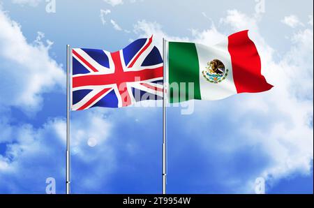 Messico, Regno Unito bandiere insieme che sventolano contro il cielo blu Foto Stock