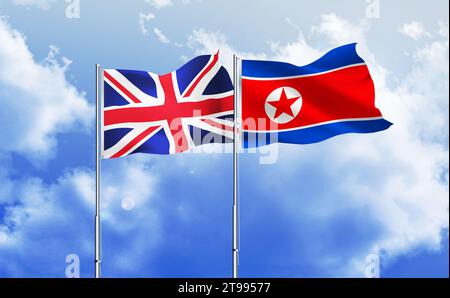 La Corea del Nord, il Regno Unito bandiera insieme sventolando contro il cielo blu Foto Stock