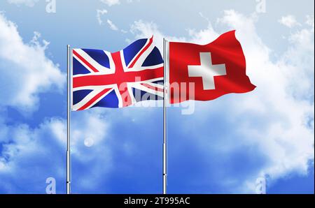 Svizzera, Regno Unito bandiere insieme che sventolano contro il cielo blu Foto Stock
