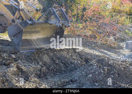 Escavatore edile livellato per la costruzione di autostrade Foto Stock
