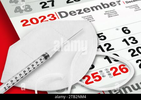 Calendario tedesco dicembre 2023 e gennaio 2024 con maschera viso e vaccinazione martedì mercoledì giovedì Foto Stock