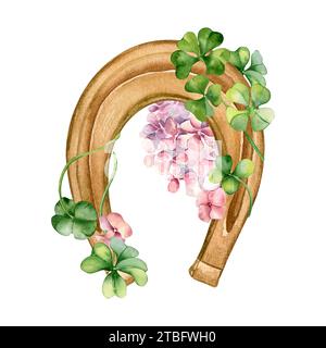 Ferro di cavallo e trifoglio con fiori primaverili illustrazione ad acquerello isolato su bianco. shamrock dipinto, ortensia rosa. Simbolo irlandese fortunato disegnato a mano. D Foto Stock