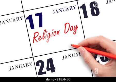 17 gennaio. Scrivere a mano il testo Religion Day nella data del calendario. Segnatevi la data. Vacanze. Concetto di giorno dell'anno. Foto Stock