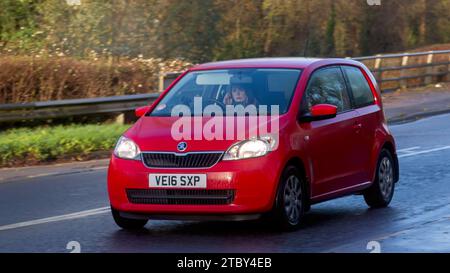 Milton Keynes,Bucks,UK - Dec 12th 2023: 2016 red Skoda Citigo car driving on a British road Foto Stock