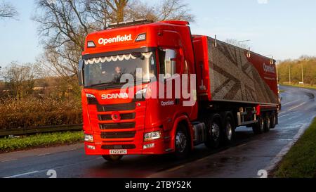 Milton Keynes,Bucks,UK - Dec 12th 2023: 2023 red Scania truck travelling on a British road Foto Stock