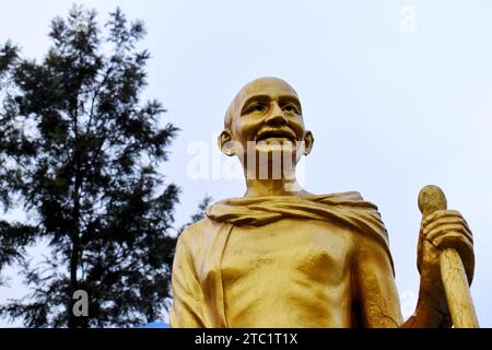 Statua dorata del Mahatma Gandhi Foto Stock