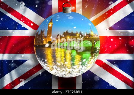 I monumenti di Londra vista serale sulla neve attraverso la palla di cristallo con la bandiera del Regno Unito, il concetto di Natale a Londra Foto Stock