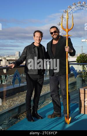 Patrick Wilson (a sinistra) e Jason Momoa durante una foto per Aquaman e il Regno perduto, al Park Plaza Hotel, Westminster Bridge, Londra. Data immagine: Lunedì 11 dicembre 2023. Foto Stock