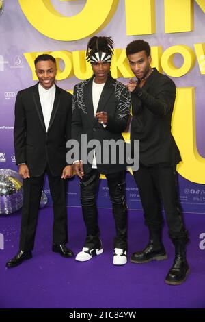 Elan Ben Ali, Fabrice "Fab" Morvan, Tijan Njie frequenta il Berliner Filmpremiere "Girl You Know IT's True" - 05.12.23 Zoo Palast Foto Stock