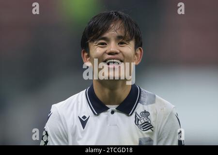 Milano, Italia. 12 dicembre 2023. Takefusa Kubo della Real Sociedad reagisce mentre la squadra festeggia il primo posto nel gruppo dopo il pareggio del 0-0 nella partita di UEFA Champions League a Giuseppe Meazza, Milano. Il credito fotografico dovrebbe leggere: Jonathan Moscrop/Sportimage Credit: Sportimage Ltd/Alamy Live News Foto Stock