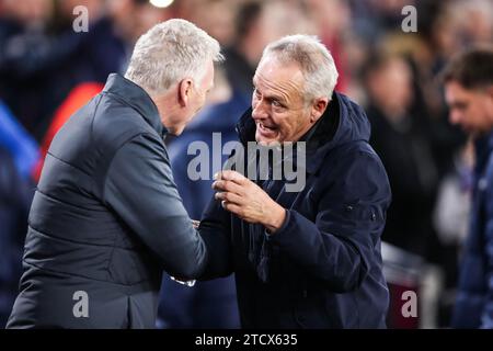 Il manager del West Ham United David Moyes e il manager del SC Freiburg Christian Streich durante la partita del West Ham United FC contro SC Freiburg UEFA Europa League gruppo A al London Stadium, Londra, Inghilterra, Regno Unito il 14 dicembre 2023 credito: Every Second Media/Alamy Live News Foto Stock