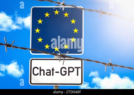 15 dicembre 2023: Firma con bandiera UE dietro una recinzione di filo spinato con l'iscrizione Chat-GPT FOTOMONTAGE *** Schild mit EU-Flagge hinter einem Stacheldrahtzahn mit der Aufschrift Chat-GPT FOTOMONTAGE Foto Stock