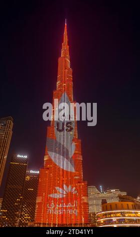 Night shot, illuminated advertising at the Burj Khalifa, Downtown, Dubai, United Arab Emirates Stock Photo