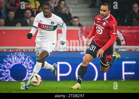 Lille, Francia. 17 dicembre 2023, Villeneuve-d'Ascq, Francia, Francia: Ousmane DEMBELE di PSG e Ismaily GONCALVES DOS SANTOS di Lille durante la partita di Ligue 1 tra Lille OSC (LOSC) e Paris Saint-Germain (PSG) allo stadio Pierre Mauroy il 17 dicembre 2023 a Villeneuve-d'Ascq Near (Credit Image: © Matthieu Mirville/ZUMA Press Wire) SOLO USO EDITORIALE! Non per USO commerciale! Crediti: ZUMA Press, Inc./Alamy Live News Foto Stock