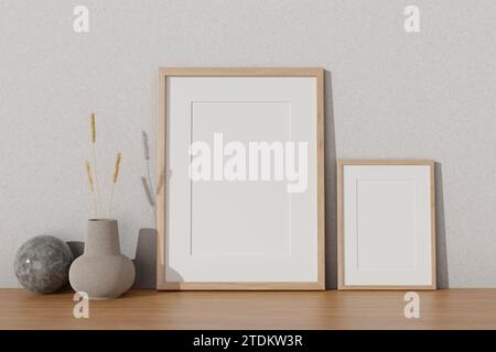 Due modelli minimali di cornici e un vaso in ceramica su un piano in legno contro la parete bianca. immagine ravvicinata. rendering 3d, illustrazione 3d. Foto Stock