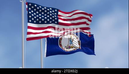 Bandiera dello stato della Virginia che sventola con la bandiera americana in una giornata limpida. Sigillo di stato al centro di uno sfondo blu scuro. rendering dell'illustrazione 3d. Selectiv Foto Stock