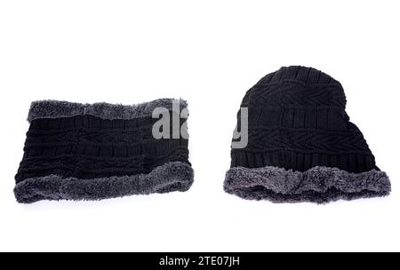 scarf and wolly hat in front of white background Foto Stock