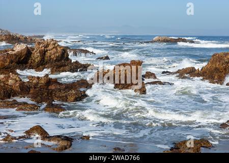 South Africa, Hermanus, Rocky coastline and sea at Kammabaai Beach Stock Photo