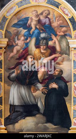 VICENZA, ITALIA - 7 NOVEMBRE 2023: Il dipinto Madonna con San Michael, St. Giulian e St. Francesco di Sales nella chiesa di San Giuliano Foto Stock