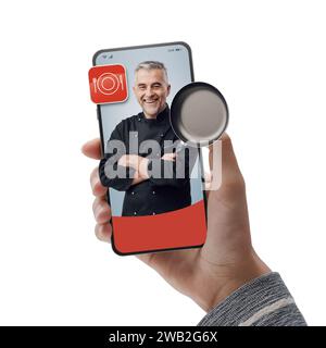 Chef sorridente sullo schermo dello smartphone: Assumi professionisti online e cucina su richiesta Foto Stock