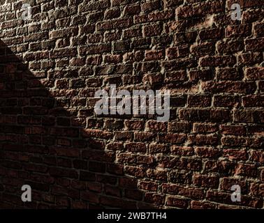 La parete in mattoni del seminterrato è poco illuminata da una singola lampada a incandescenza. Foto Stock