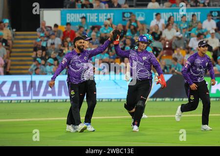 Brisbane, Australia. 7 gennaio 2024. Nikhil Chaudhary (Hobart) festeggia dopo aver preso il wicket di Mac Wright (Brisbane) Foto Stock