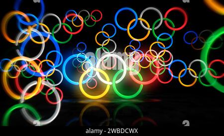 Poznan, Polonia, 7 gennaio 2024: Anelli olimpici simbolo al neon. Lampadine colorate per insegne dei Giochi Olimpici internazionali. Illustrazione 3d del concetto astratto. Foto Stock